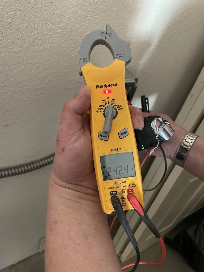 Voltage testing with clamp meter during Outlet Installation in Lewiston